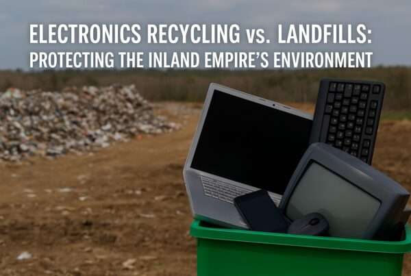Electronic waste sitting in trash bin in a field of trash